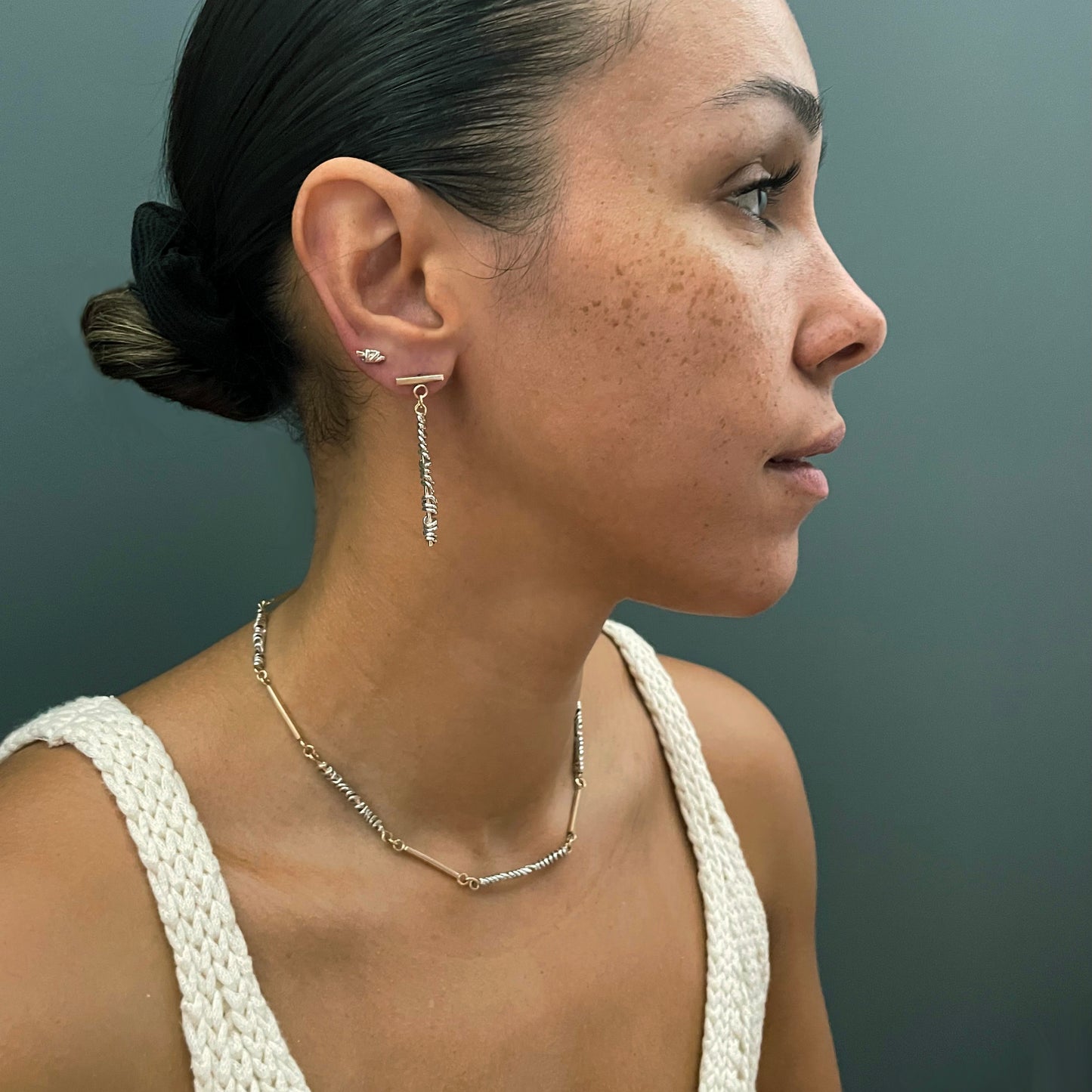 These dangly earrings, shown on the body, are part of The Golden Thread Collection, inspired intuitively and randomly so that each piece by nature is unique and slightly different to the next. The piece shown is solid 9ct recycled gold. Hallmarked by the London Assay Office.